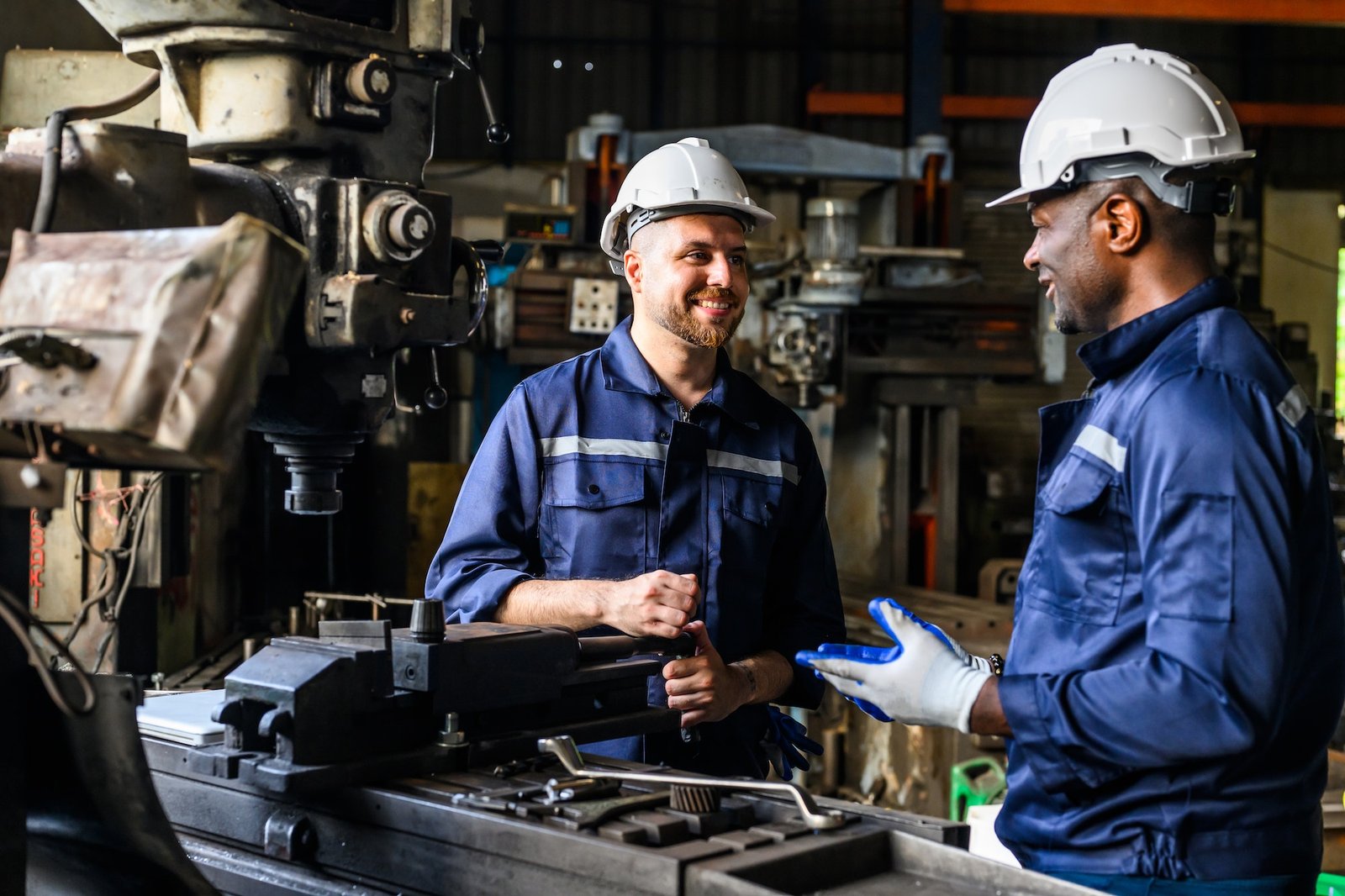 Professional mechanical engineer team checking and repairing engine machine