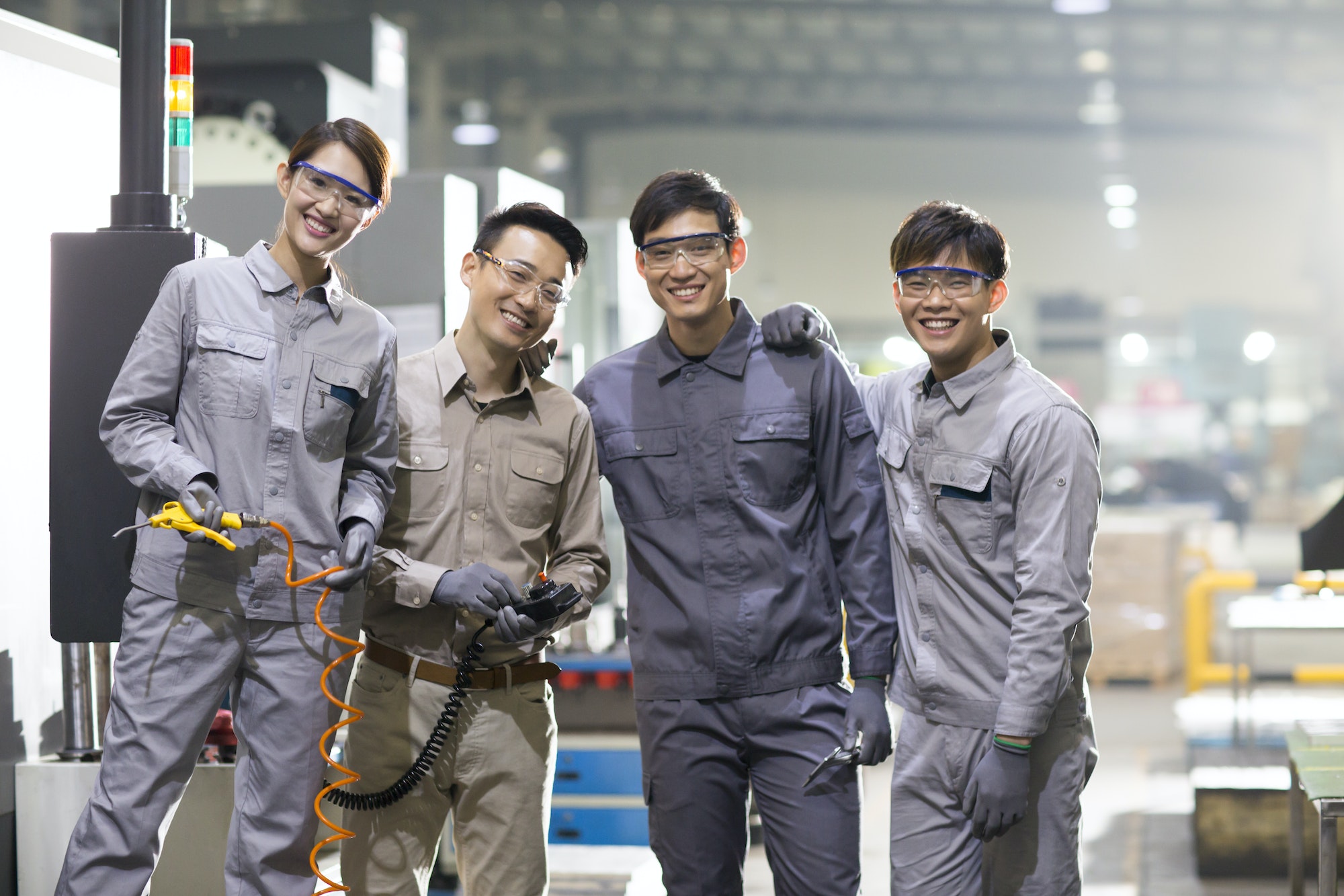 Confident engineering team in the factory